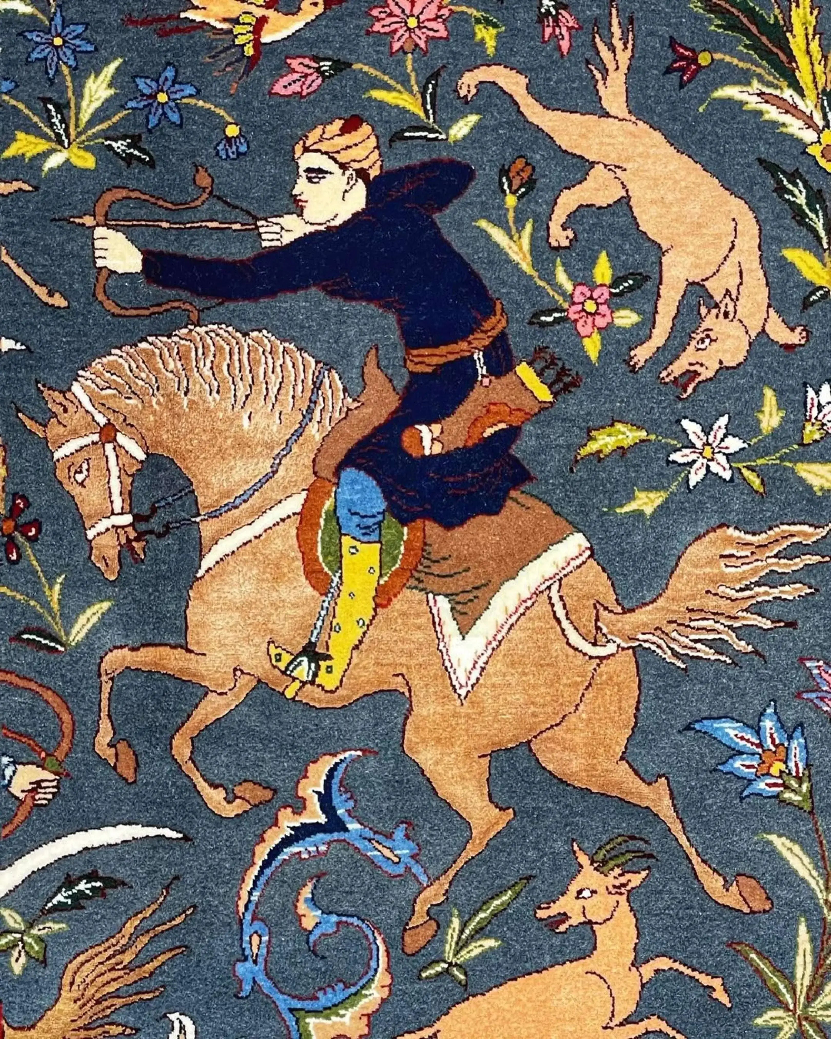 Isfahan rug with intricate natural dye motifs depicting a traditional hunting theme.